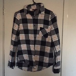 A button down shirt with across in the back